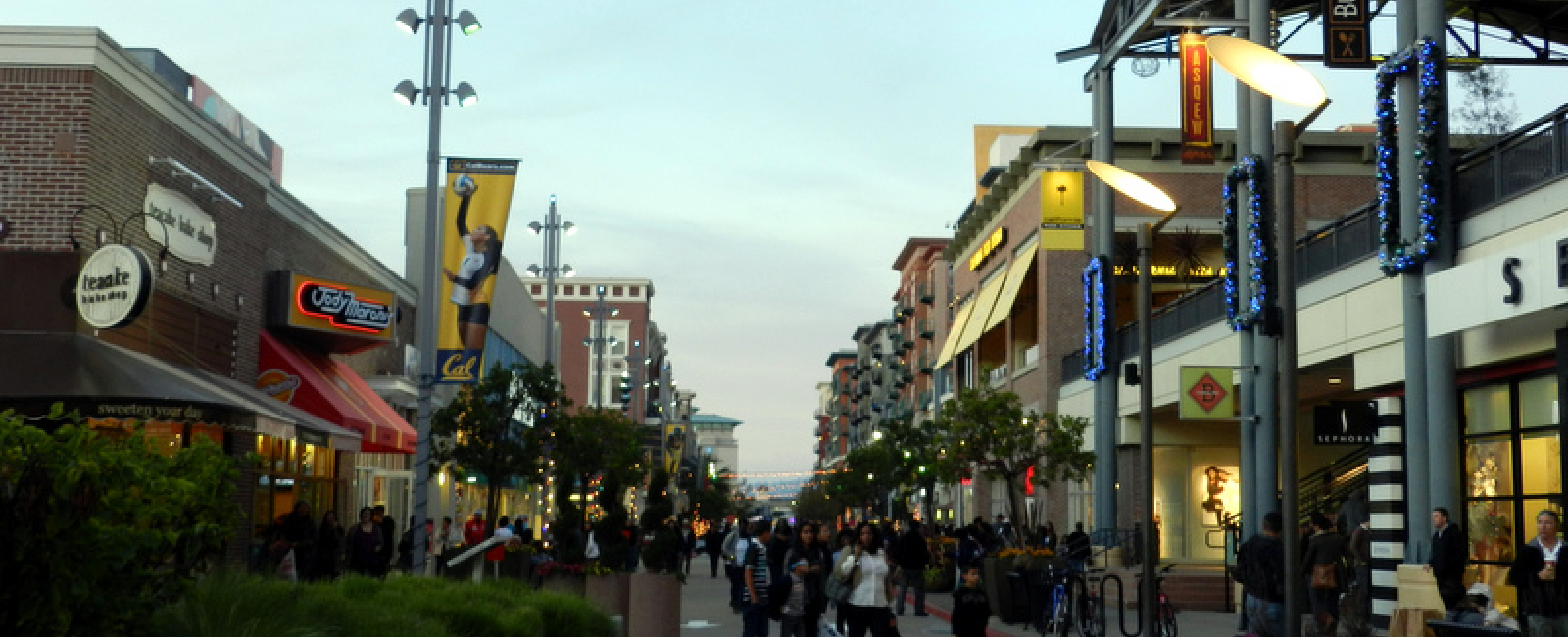 Image of a street with many new, attractive buildings/