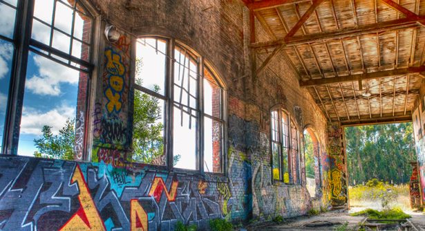 Image of abandoned railyard with graffiti