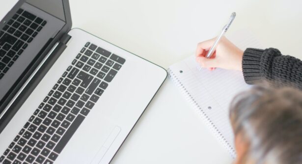 Image of person at a laptop from above
