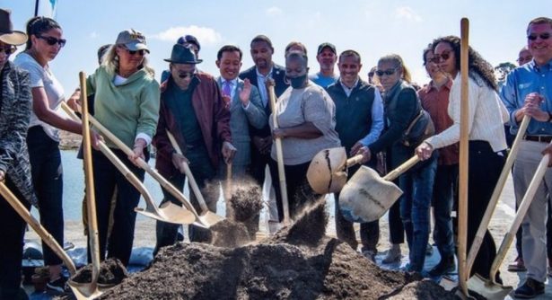 Group of people with gold shovels at ground breaking for India Basin Shoreline Park. San Fran sisco