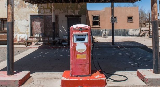 Abandoned gas station with old pumps